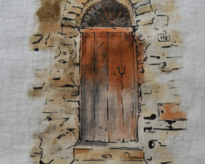 close up T-Shirt made from high-quality organic cotton, this unique hand-drawn illustration captures the essence of a 100-year-old door in a Sicilian village