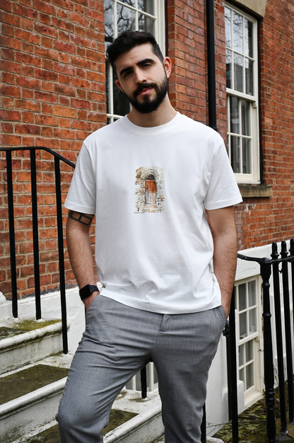 T-Shirt made from high-quality organic cotton, this unique hand-drawn illustration captures the essence of a 100-year-old door in a Sicilian village