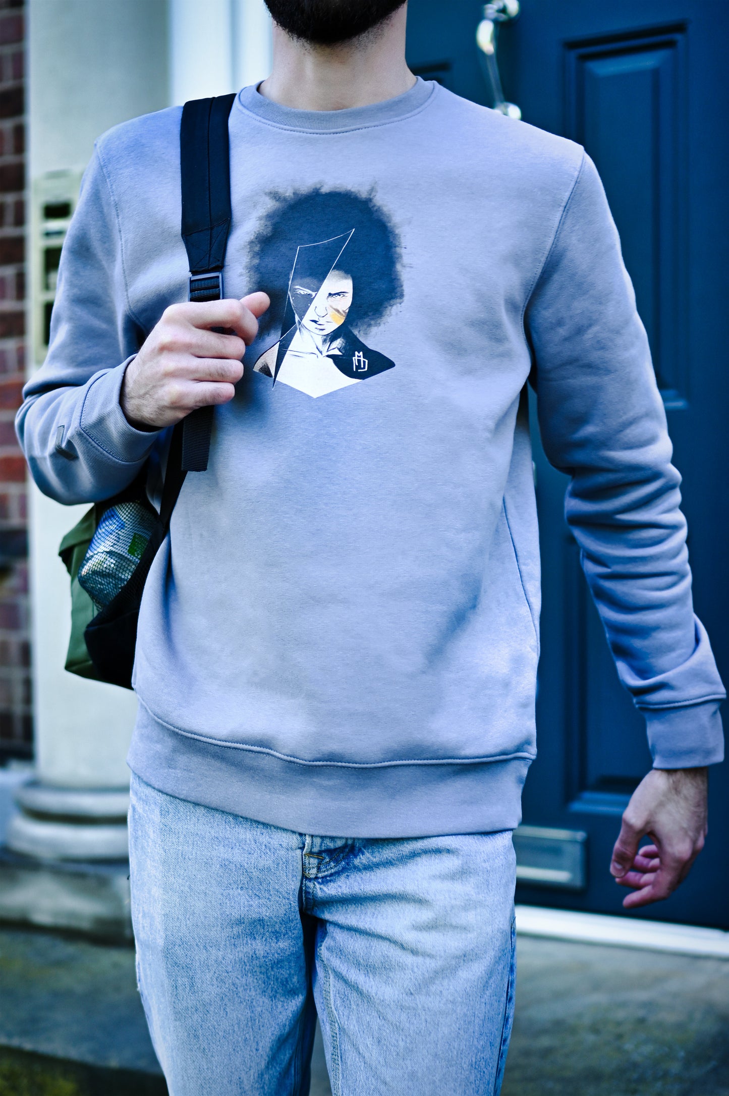 organic cotton and recycled polyester sweatshirt featuring a hand-drawn illustration of the face of a female warrior